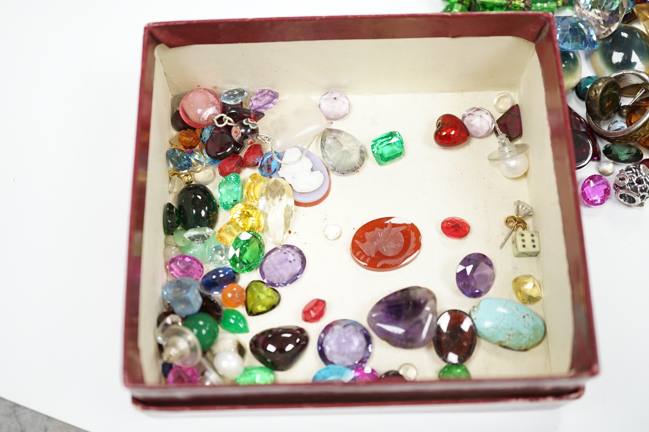 Assorted unmounted cut gemstones including rutilated quartz and other costume jewellery including 925 and paste set tennis bracelet and a 9ct gold ring, etc.